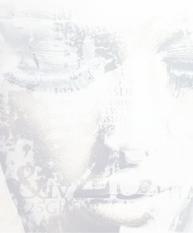 A piece of modern, textured art depicting a woman's face with her eyes closed, overlaid with abstract typography and patterns. This artwork is visible on the wall in the clinic's lobby. faded